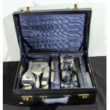 A fitted travelling case with silver backed pieces