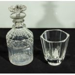 A small glass decanter and a glass