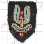 Special Air Service WW2 SAS cloth beret / cap badge. A worn example with black hessian backing