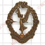 Womens Legion 2nd type post 1934 bronze cap badge.Die-stamped with winged figure to centre.