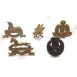 5 WW2 plastic economy Infantry cap badges. Lincolnshire (bent to cap) ... Devonshire (Stanley) ...