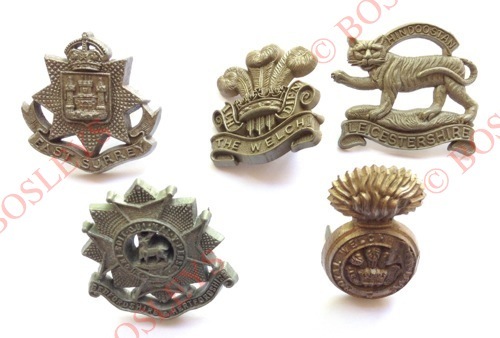 5 WW2 plastic economy Infantry cap badges. East Surrey ... Welch (Stanley, one blade absent) ...