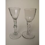 Two Georgian faceted stem drinking glasses, one with ovoid bowl on an over sewn conical foot, 6 1.8"