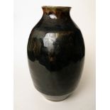 Chris Carter - a Temmoku glazed studio pottery vase, 10" high, impressed pottery mark to base, along