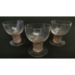 Rene Lalique - a group of three Ricquewihr pattern Madeira glasses with stained pink patinated