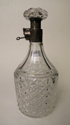 A good George V cut glass shouldered decanter with an Aspreys & Co Ltd silver decanter lock and