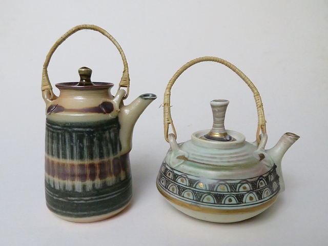 Mary Rich - two studio pottery miniature teapots with cane handles, one with gilt highlights, artist