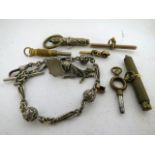 A small selection of watch keys to include a Breguet 'tipsy' key together with a silver fob chain