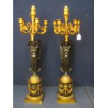 A pair of early 20th century Empire style bronze and brass table lamps in the form of Grecian figure