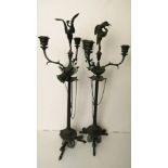 A pair of 19th century bronze Empire style candelabra mounted with a crane over three branches,