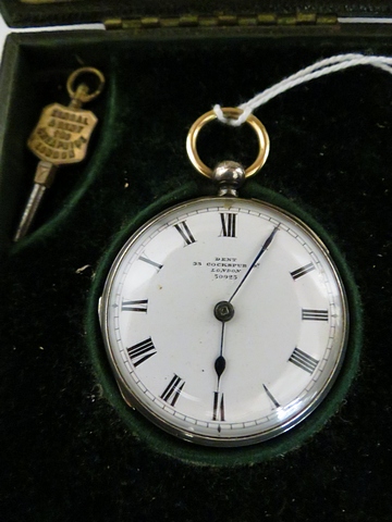 A late 19th century silver fob watch with gold bow and hinges, by Dent, London. Fusee lever movement