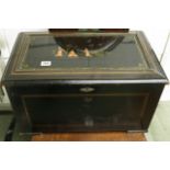 Circa 1900 a Swiss music box in a Japanned case with twelve airs striking on bells