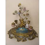 A 19th century Sevres and ormolu ink stand having applied porcelain flowers over a drip tray and two