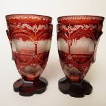 A pair of 19th century Bohemian ruby flashed, cut and engraved spa beakers on petal cut feet, 4 1/2"