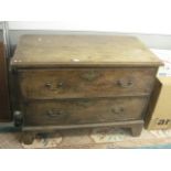 A Georgian 18th century provincial oak chest of two long drawers over bracket feet