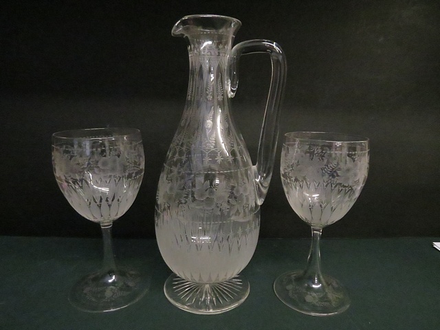 A Victorian engraved glass water/lemonade set, comprising a jug of pear form, with narrow neck.