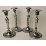 A set of four late 19th century Adams revival silver plated candlesticks on oval bases