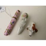 A Victorian porcelain whistle in the form of a dogs head, along with another Victorian whistle in
