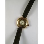 A ladies 9ct gold half hunter cased wrist watch with white enamelled dial, movement marked SS & B,