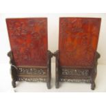 A pair of 19th century Chinese carved amber table screen panels depicting female figures and a toad,