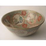 A 19th century Japanese Kaga ware bowl decorated with panels depicting craftsmen, signed Dai
