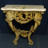 A 19th century white marble topped console table over an ornate gilt rococo style base