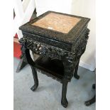 A fine 19th century carved oriental rosewood, marble topped vase stand with ornate, all over