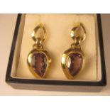 A pair of 9ct yellow gold amethyst set earrings