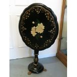 Victorian paper mache tilt topped table on pedestal base and three cast iron feet, 29" high