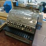 A late 19th century ornate cast and silver plated National cash register