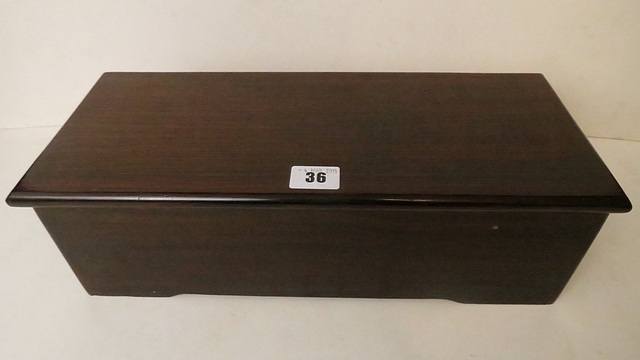 An Andre Savalle musical box in a later rosewood case