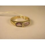 A contemporary 9ct yellow gold amethyst and diamond ring