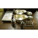 A pair of sauce boats, cruets, toast rack and match case