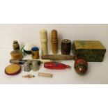 A selection of Tartan ware, Mauchaline ware and carved wooden bodkin cases, tape measures, thimble