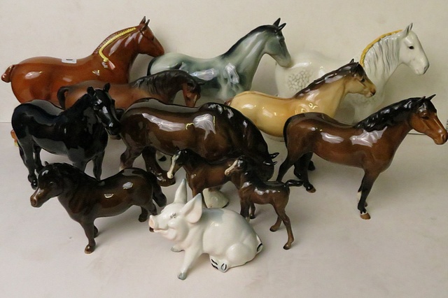 A collection of Beswick horse figurines to include Masse Dainty, along with a Bretby horse