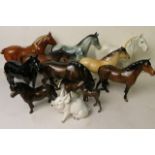 A collection of Beswick horse figurines to include Masse Dainty, along with a Bretby horse