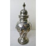 A silver sugar caster