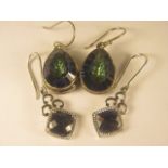 A pair of large silver topaz earrings together with a pair of sapphire earrings