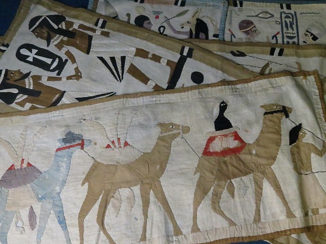 A collection of Egyptian wall hangings