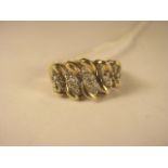 A 9ct yellow gold retro style ring set with brilliant cut diamonds