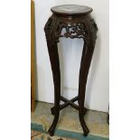 A Chinese rosewood marble topped vase stand