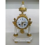 A 19th century French white marble and gilt metal mantle clock having an enamel dial on raised feet