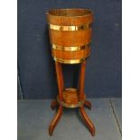 Alex Hamilton - an Edwardian Tubs for Shrubs teak and brass coopered jardiniere on splayed legs,