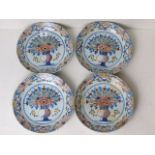 Adrian Koeks Factory - four 18th century Dutch Delft plates decorated with a vase of styalized