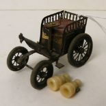 Early 20th century tape measure in the form of a vintage car and a pair of bone miniature Stanhope