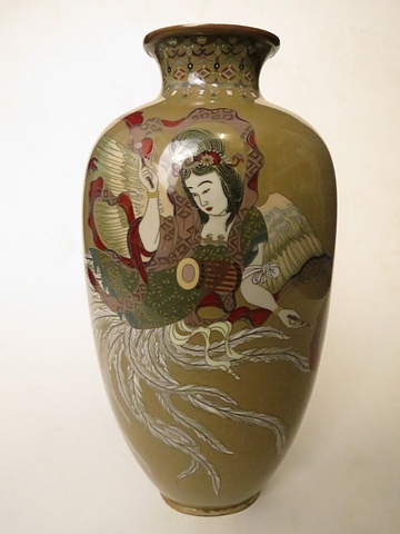 A Japanese cloisonné vase having a mocha coloured enamel base with a scene of a geisha girl on a bed