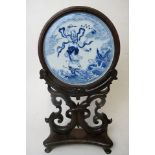 A late 19th /early 20th century Chinese blue and white porcelain table screen, mounted in padouk