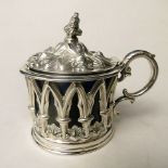 A Victorian silver  mustard pot having an ornate pierced lid with blue glass liner, Sheffield 1863