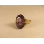 A 9ct gold oval cut amethyst solitaire ring
