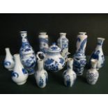 A collection of Kangxi and later Chinese miniature blue and white vases to include a pair of pear